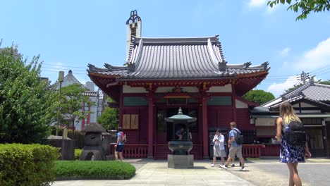 people walking through temple