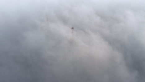 dense fog over wawel castle in krakow, poland with slightly visible tower