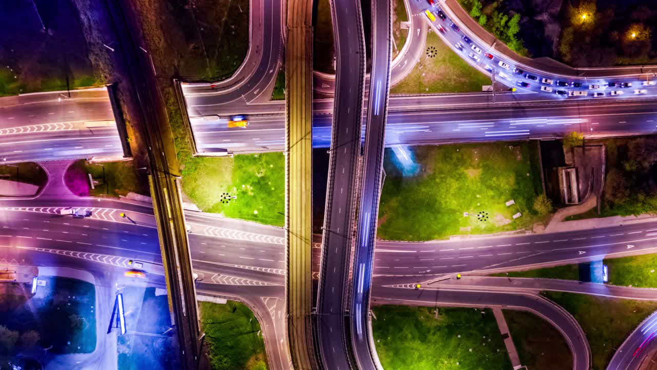 Night Timelapse Aerial view of a freeway intersection traffic trails in night Moscow