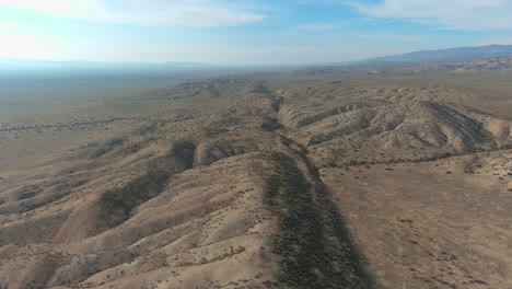 aerial over the cracked san andreas earthquake fault on the carrizo plain in central california