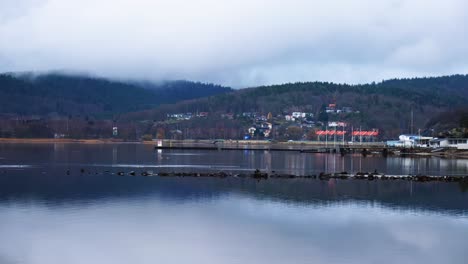 foggy mountains and seaside town of ljungskile in uddevalla municipality, västra gotaland county, sweden. wide shot