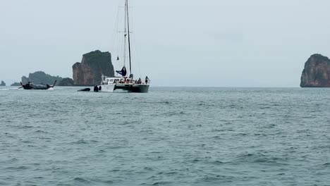 sailing catamaran near krabi's scenic rock formations