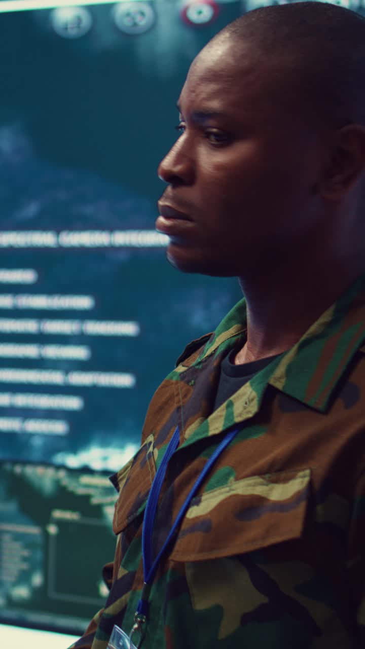 Military Officer Writing Notes in High-Tech Control Room