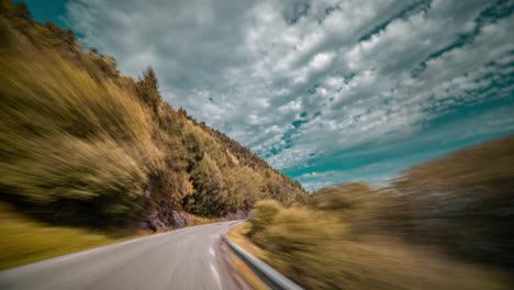 A-fast-drive-on-the-narrow-two-lane-rural-road-along-the-Tingvollfjorden-near-Sunndalsora,-Norway