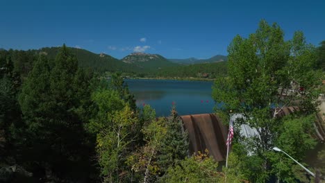 summer evergreen dam lake house colorado usa aerial drone upper bear creek golf course mount blue sky evans three sisters american flag usa sunny morning rocky mountains town denver front range circle