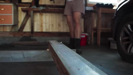 cropped view of a man using electric screw driver in woodworking