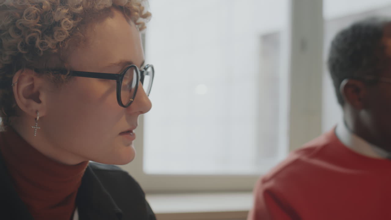 Multiethnic Business People Having Discussion in Office