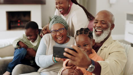 black family, home and happy laughing on sofa