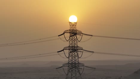 Slow-motion-timelapse-shot-of-sunset-behind-the-transmission-tower