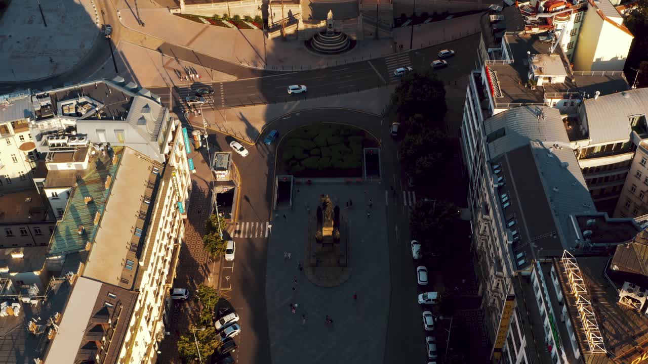 Wenceslas Square and National Museum in Prague, drone top down view tilting up, sunset colors