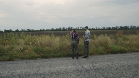 farmers discussing field conditions