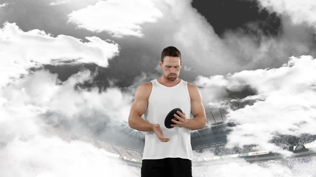 디스크 던지기 운동 선수 가 던지기 위해 준비 하고 있다