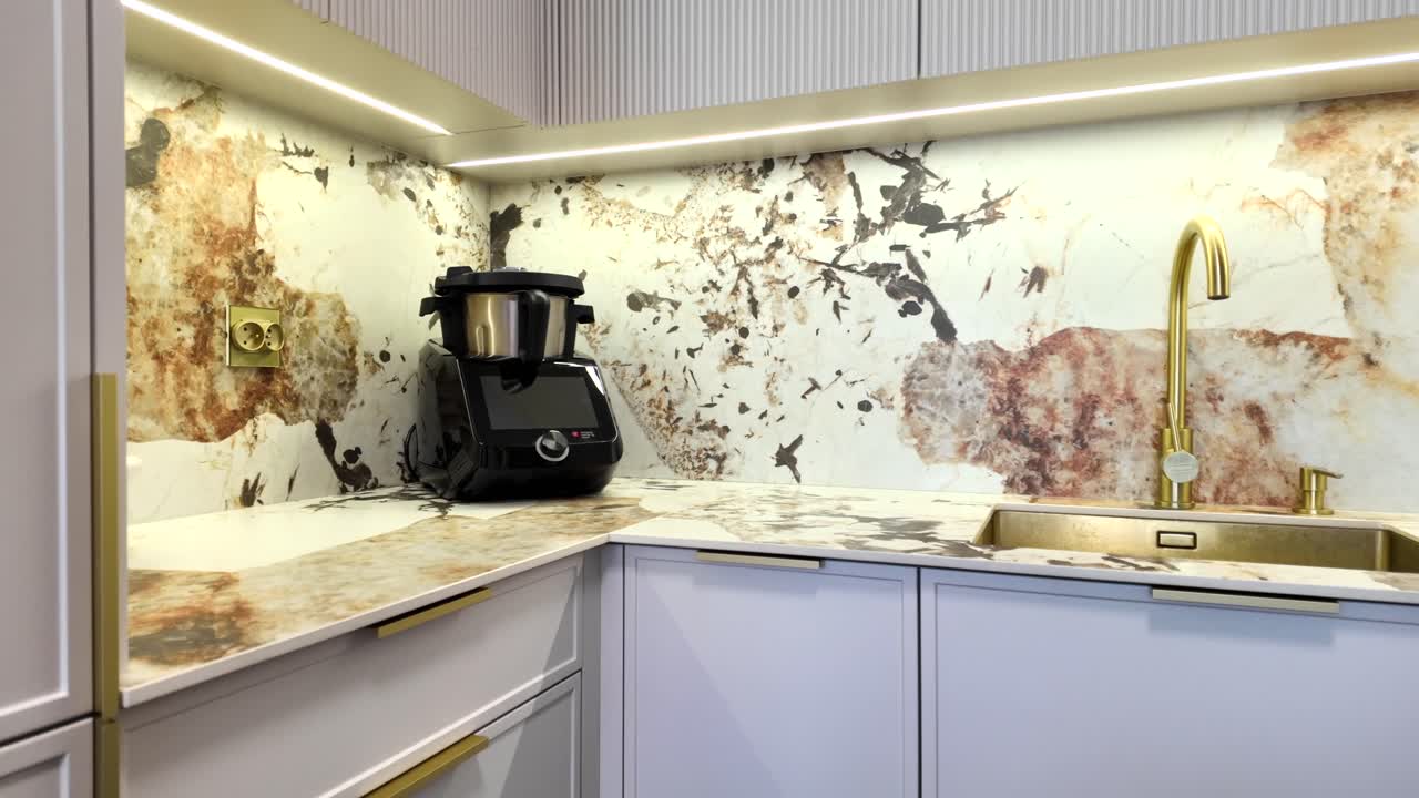 Luxurious interior. Sintered quartz and gold sink and faucet