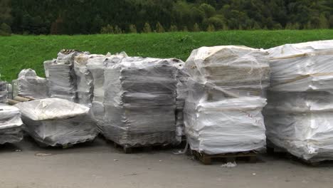 panning clip of landfill filled with packed asbestos and other trashes