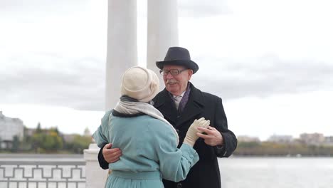 emotional dance senior couple dancing together embrace at home elderly man and woman dancing bonding emotional dance senior couple dancing together embrace at home elderly man and woman dancing bonding smiling moving to the rhythm in romantic vibe enjoying their anniversary active relationship
