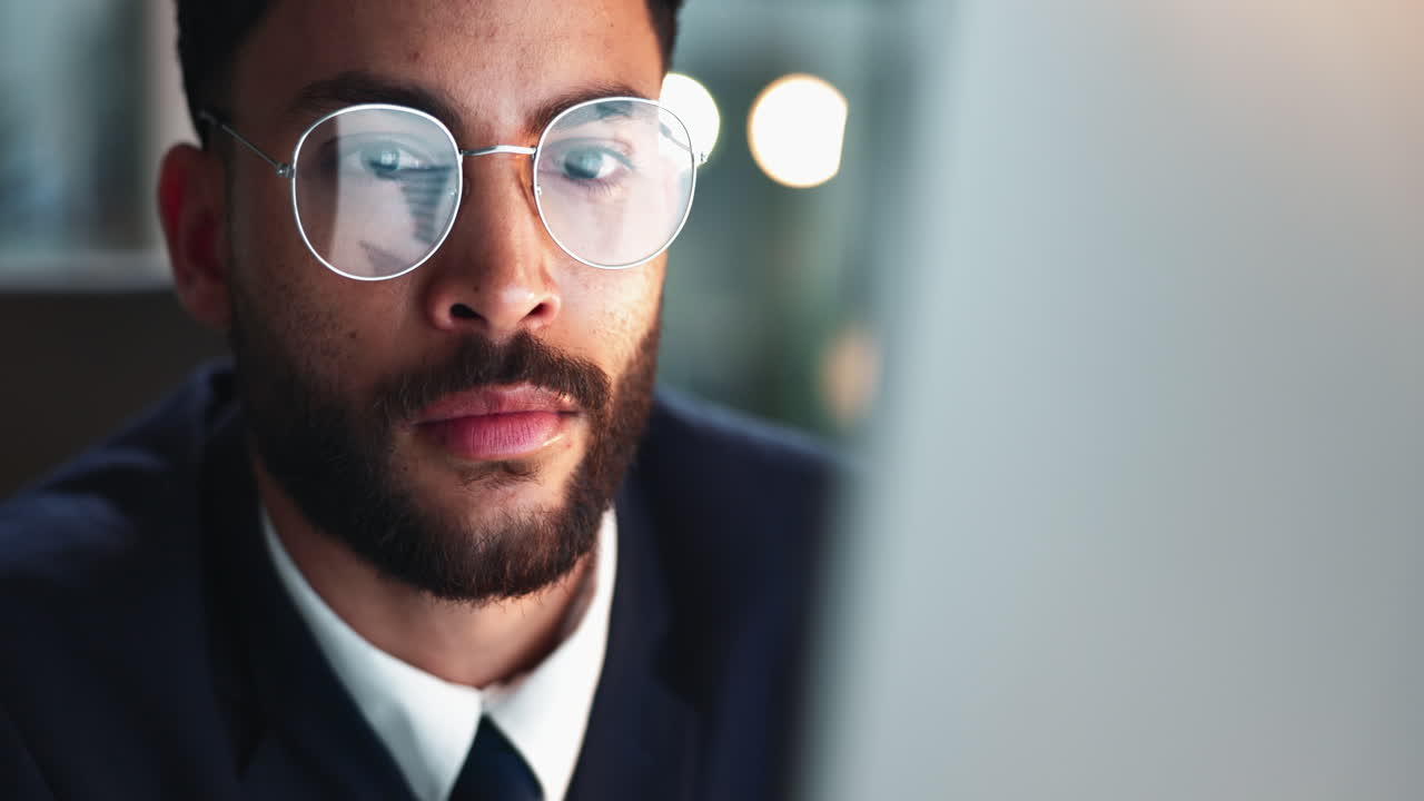 Portrait of a focused man working on a computer