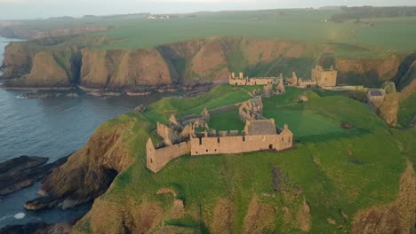 aerial footage of dunnottar castle at dawn, aberdeenshire, scotland