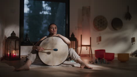 woman meditating and drumming
