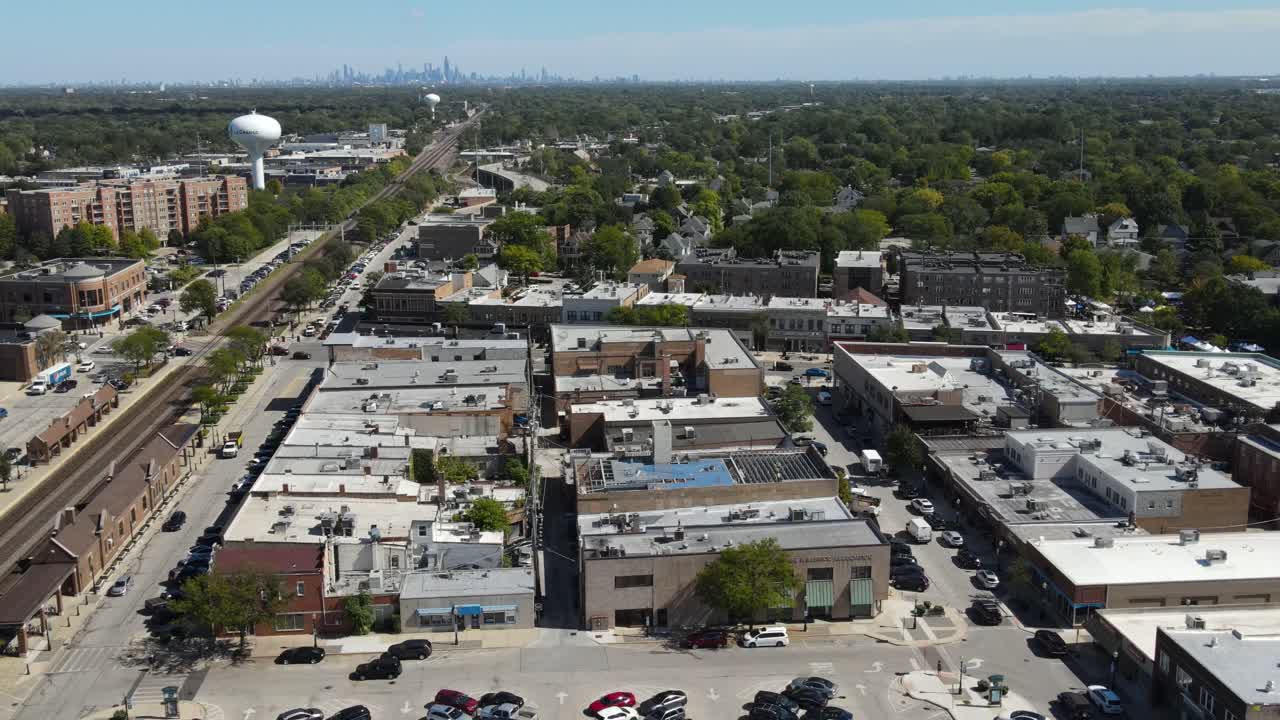 La Grange, IL on a sunny fall day, showcasing streets, buildings, and the suburban landscape With Downtown Chicago in Background. Crane Up Right Zoom x1 Day E