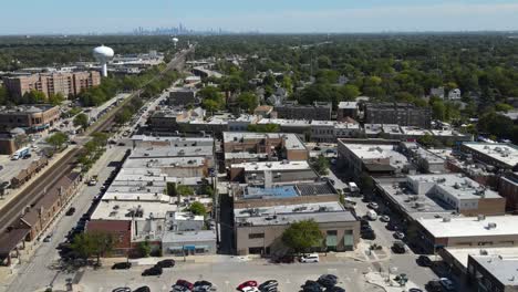 la grange, il on a sunny fall day, showcasing streets, buildings, and the suburban landscape with downtown chicago in background. crane up right zoom x1 day e
