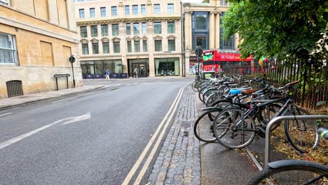 city street scene with bicycles and shops in oxford, uk