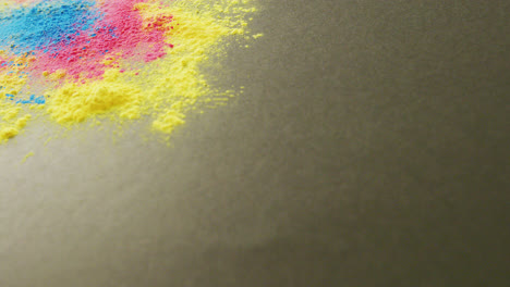 video of multi coloured powders with copy space on black background