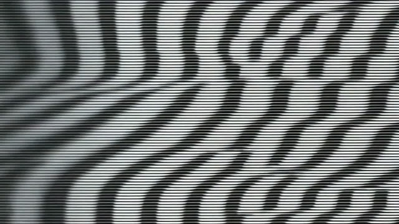 Following glitch bars receding, interference undulating on digital display, with glitch artefacts