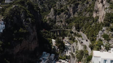 Drone-shot-flying-through-Italy's-steep-mountainside-in-Praiano
