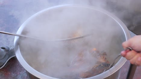 boiling live raw fresh blue river prawn in water cooking in deep pot