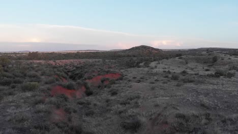 drone descending into a valley on a cloudy overcast day