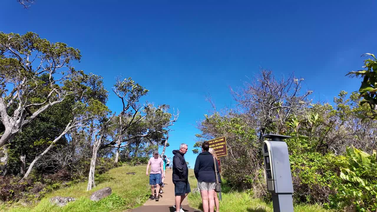 walking POV towards Kalalau Lookout, Kauai, Hawaii. superb view of napali coast Kalalau Valley. most photographed and well recognized valleys in all of Hawaii featured in many movies and TV show