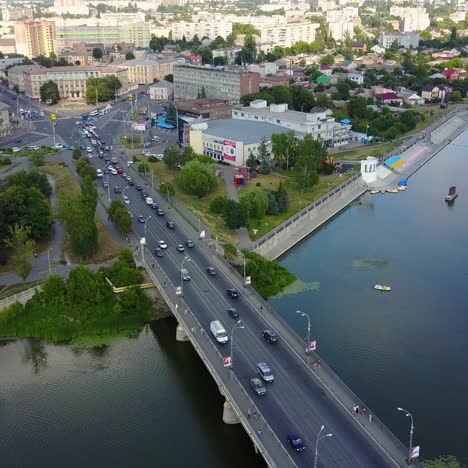 bridge road with automobile traffic. vinnitsa, ukraine - july 2017: aerial top view of bridge road automobile traffic of many cars, transportation concept