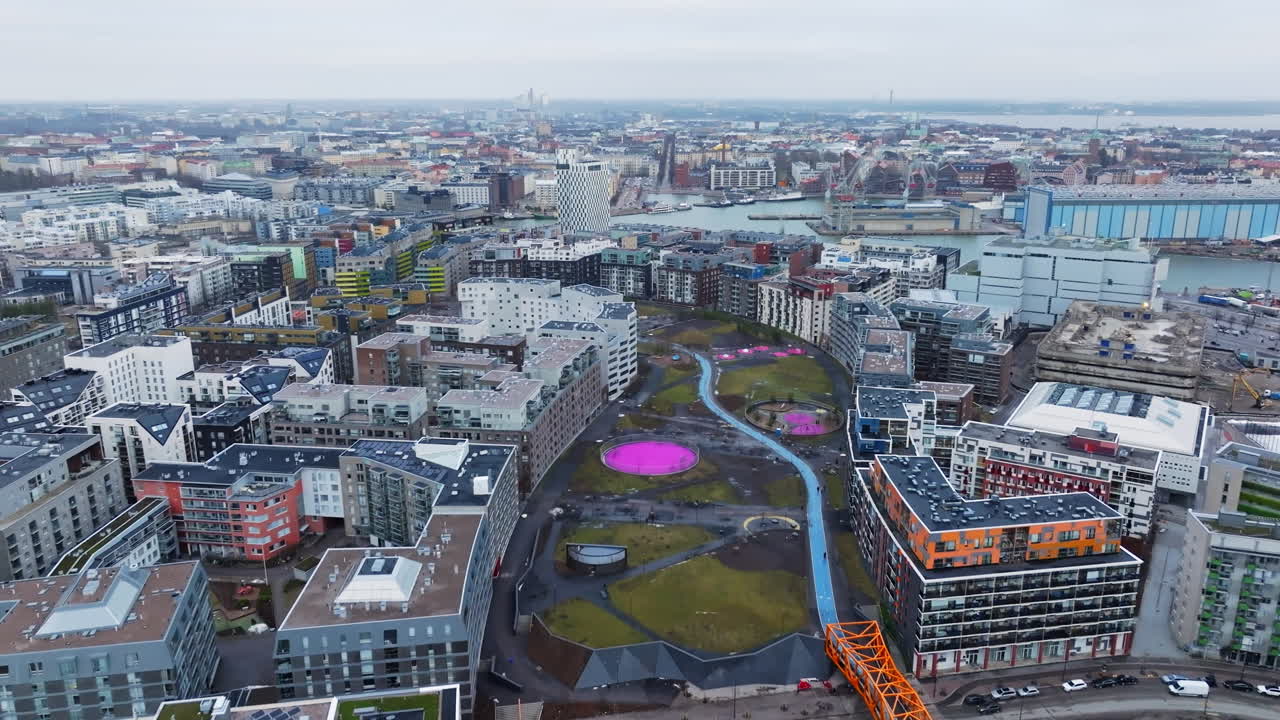 Drone flying over the Hyvantoivonpuisto park, cloudy day in Jatkasaari, Helsinki