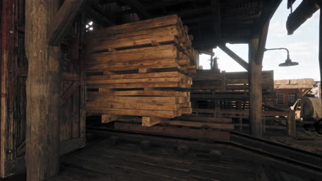 old wooden lumber stacked on railway cart in abandoned factory