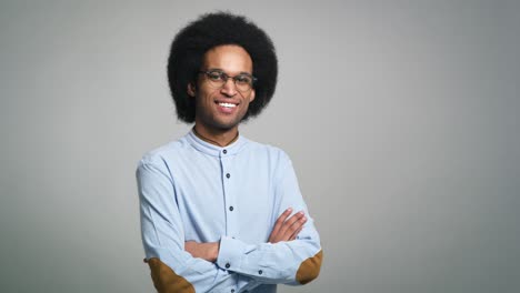 Portrait-of-smiling-young-African-man-in-studio-shot