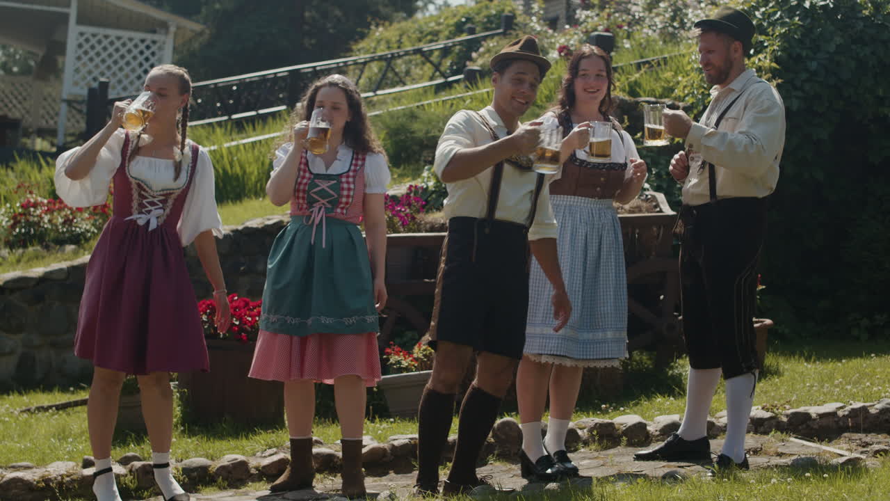 People in traditional clothing celebrating Oktoberfest with beer
