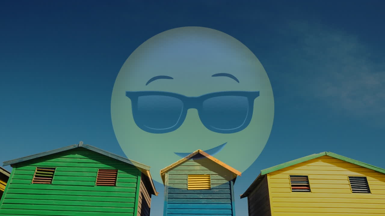 cara sonriente con gafas de sol animación sobre coloridas cabañas de playa bajo el cielo azul