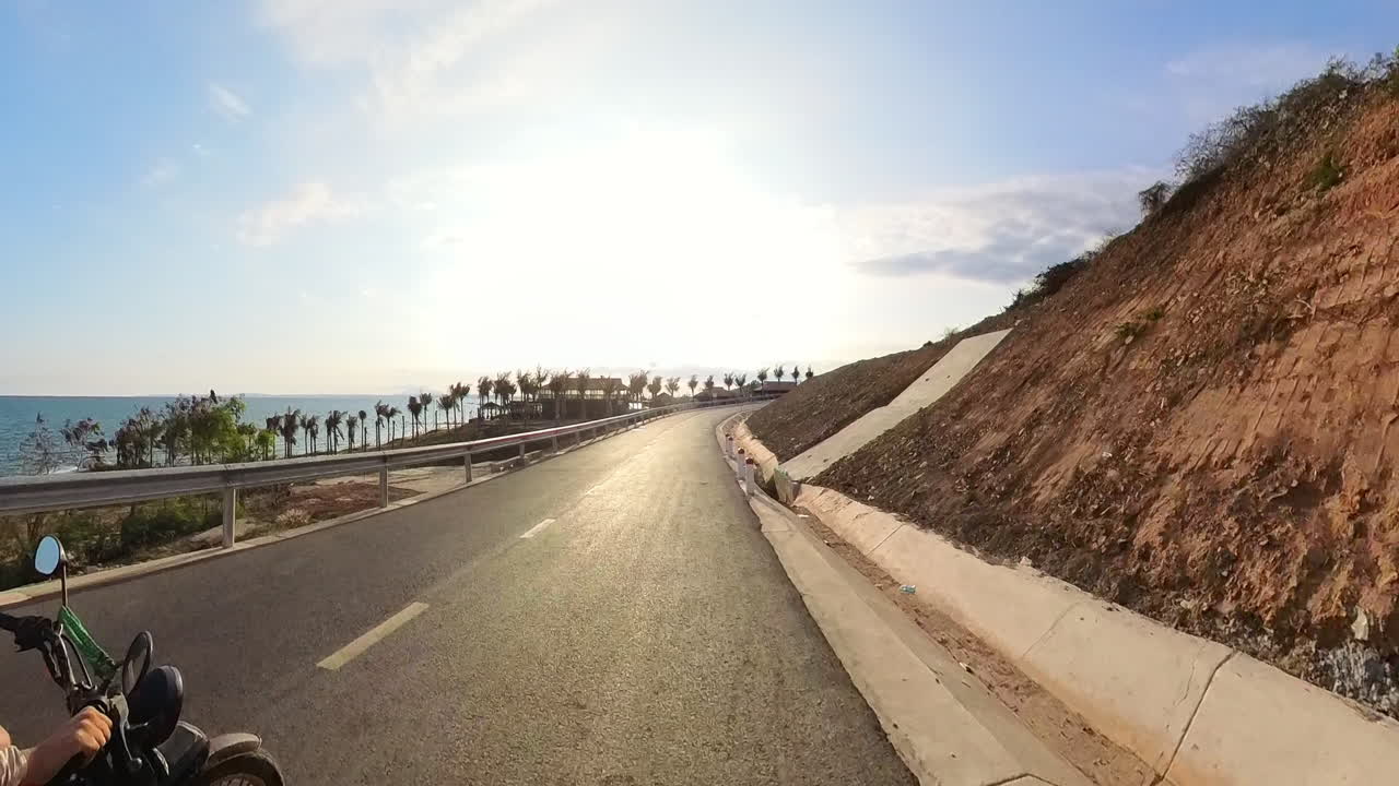 POV Riding A Motorcycle Along The Beautiful Sunset Coast Of Vietnam.