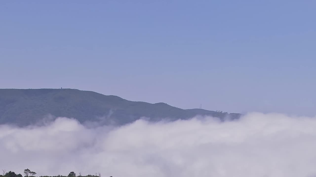 Stunning aerial view of hills shrouded in clouds in Madeira, Portugal