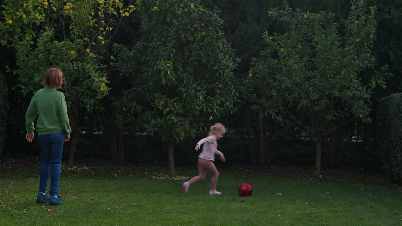 Brother and Sister Playing Ball