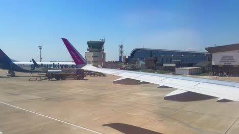 plane window view takeoff suceava airport in romania, fly airplane wing view