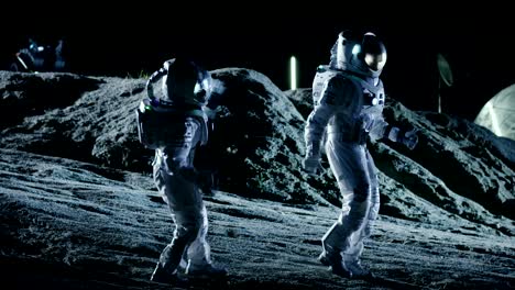 male and female astronauts wearing space suits dance on the surface of the alien planet. humanity colonizing space celebration theme.