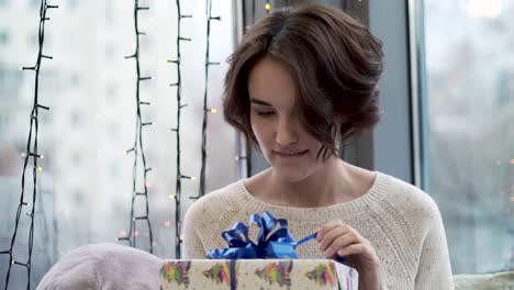 excited woman opening a gift