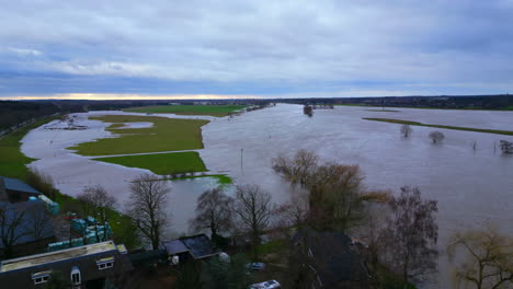 meuse in limburg netherlands emerges from the banks of floodplains under water