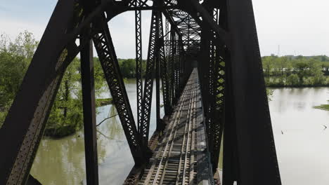 drone shot of railroad bridge over lee creek in van buren, arkansas, united states