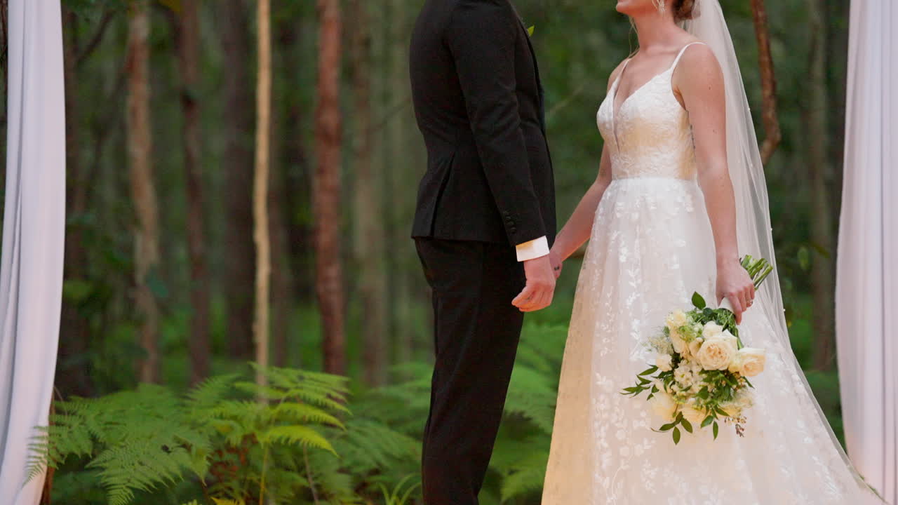 Close Up Reveal Of Traditional Bride And Groom With Green Forest Background On Wedding Day, 4K Slow Motion