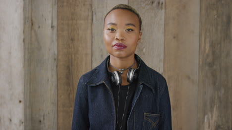 portrait-of-young-african-american-woman-looking-serious-attractive-black-female-student-wearing-stylish-fashion-wooden-background