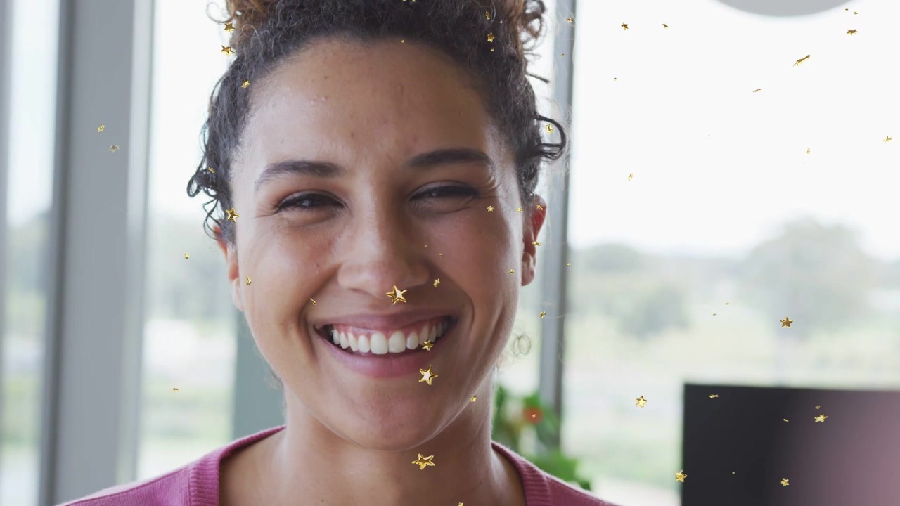 Woman smiling and laughing, touching neck, camera gaze starting gold stars overlay for marketing