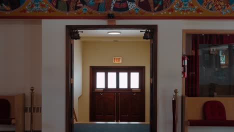 entrance and exit of vibrant orthodox iconography church entrance in byzantine style. chicago, illinois, usa.