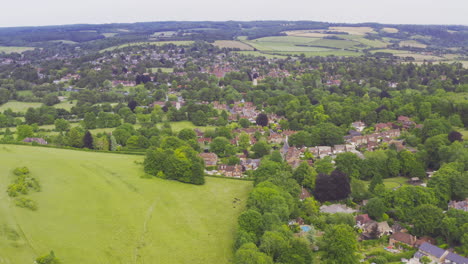 Aerial-Drone-Shot-Of-English-Summer-Town-And-Countryside-In-Streatley-Hill--West-Berkshire-UK